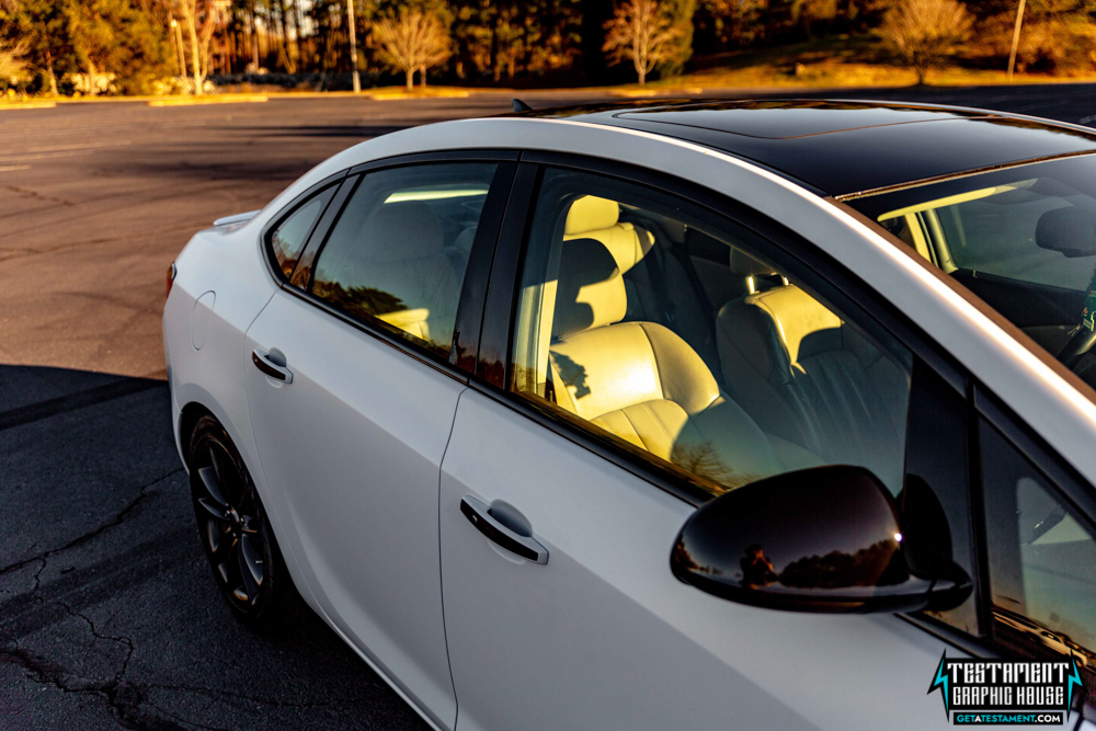 2014 Buick Verano Wrapped in 3M Satin White with a full Chrome Delete Testament Graphic House Denver NC