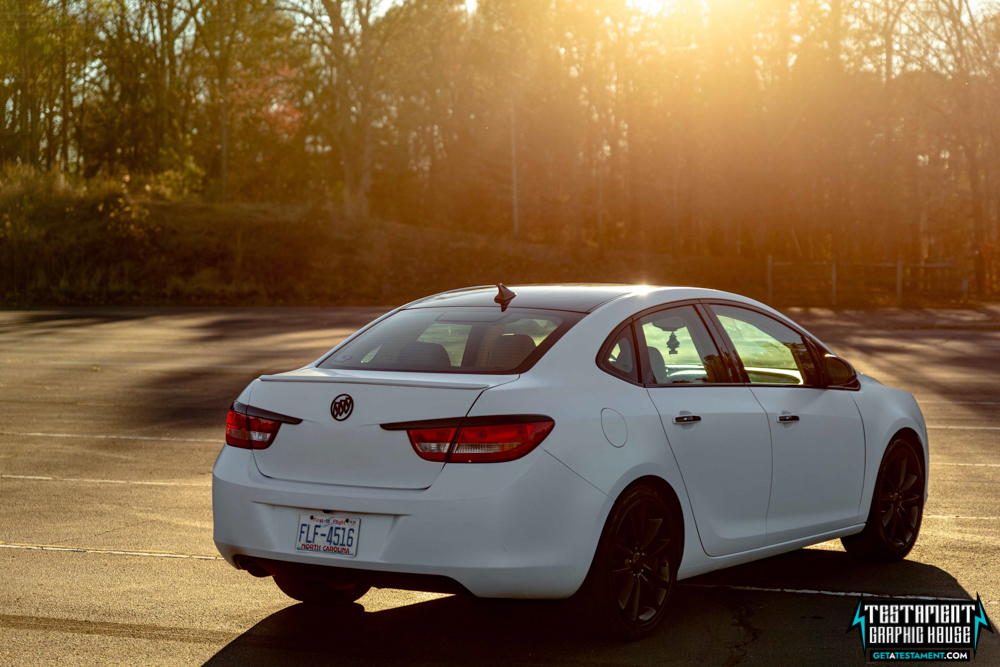 2014 Buick Verano Wrapped in 3M Satin White with a full Chrome Delete Testament Graphic House Denver NC