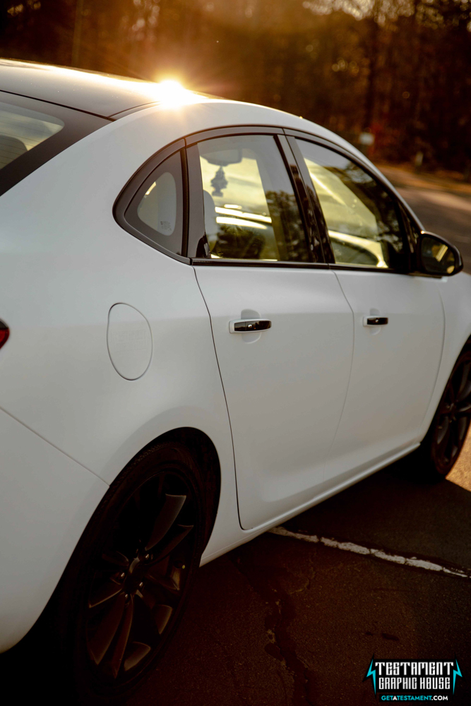 2014 Buick Verano Wrapped in 3M Satin White with a full Chrome Delete Testament Graphic House Denver NC