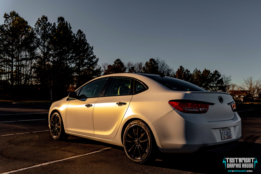 2014 Buick Verano Wrapped in 3M Satin White with a full Chrome Delete Testament Graphic House Denver NC