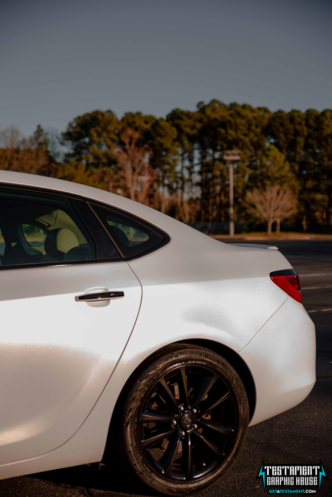 2014 Buick Verano Wrapped in 3M Satin White with a full Chrome Delete Testament Graphic House Denver NC