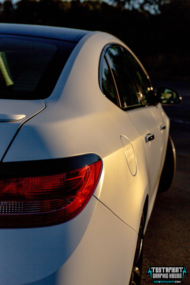 2014 Buick Verano Wrapped in 3M Satin White with a full Chrome Delete Testament Graphic House Denver NC